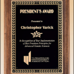 8 X 10 1/2 Walnut stained board w/ leaf design plate